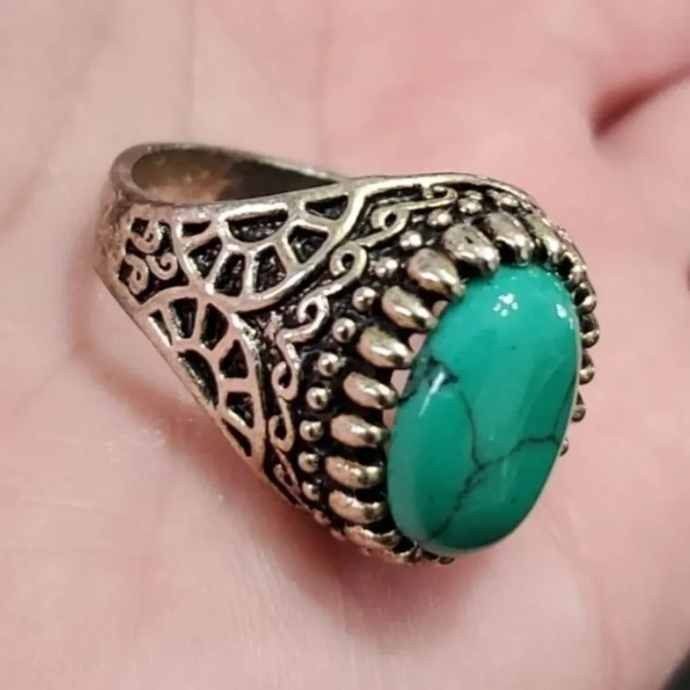 Silver tone ring with blue stone approx 11